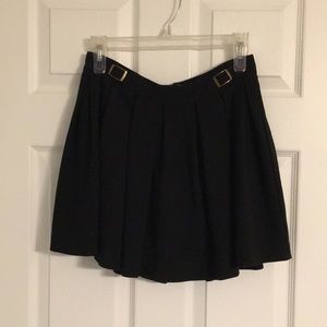 Black pleated mini skirt